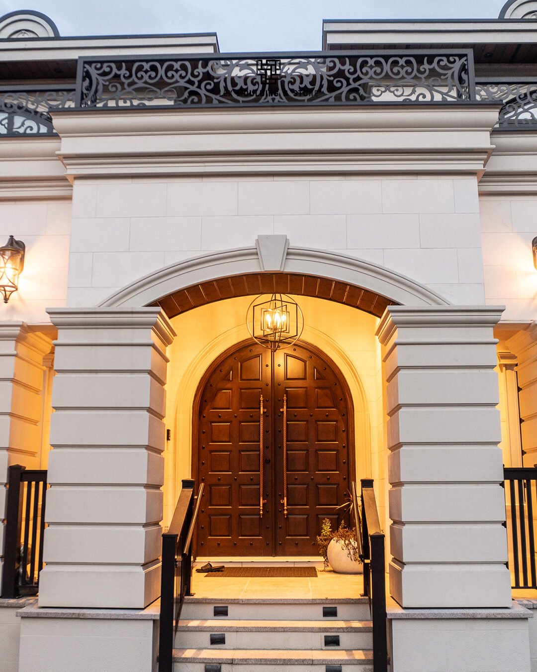 Grand front entry with moulding and stone surround